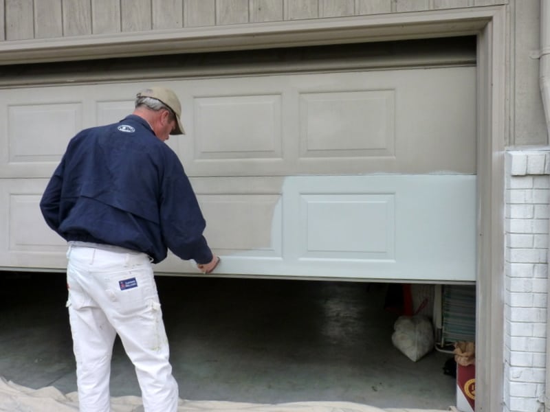Door painting service image showing a professional applying fresh, high-quality paint to a residential or commercial door. This service enhances appearance, protects the door from weather and corrosion, and restores a clean, modern look. Expert painting provides durable finishes, improves aesthetics, and maintains long-term door quality for various properties.